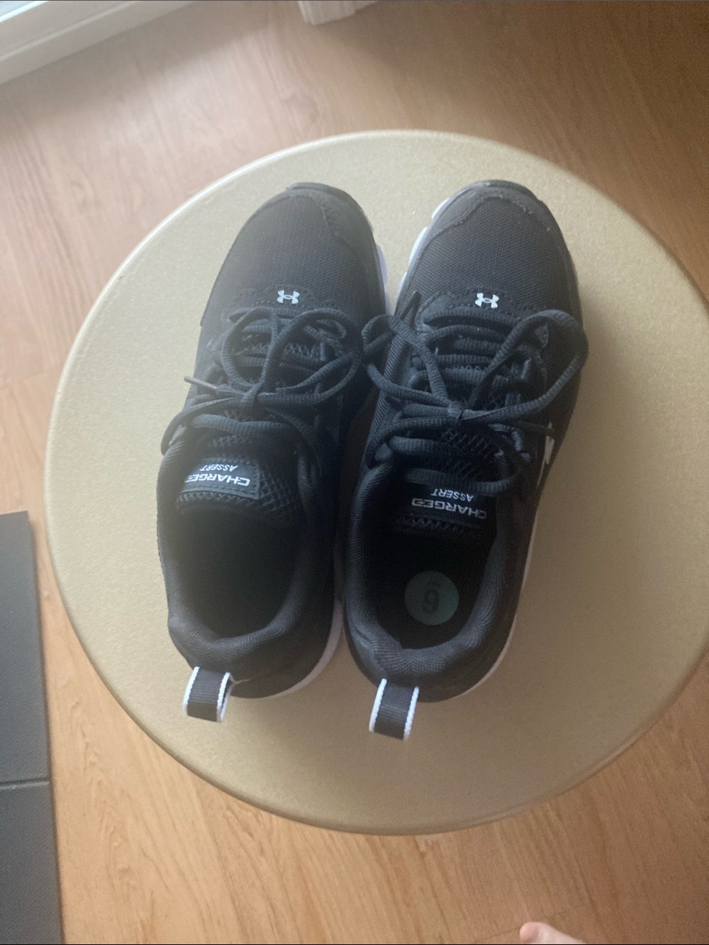 Under Armour Black and White Charged Assert Lightweight Trainers